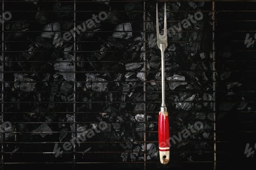 Preview: Barbeque fork on charcoal
