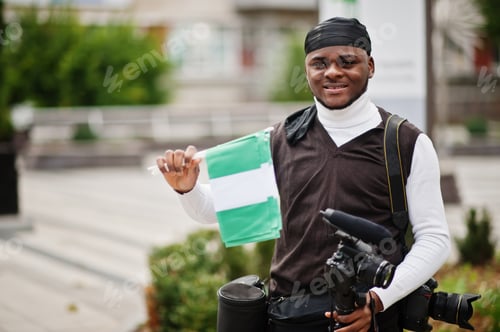 Preview: Young african man hold flag