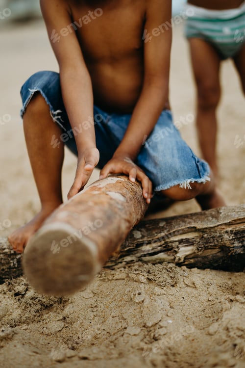 Preview: Crop Black boy playing on beach