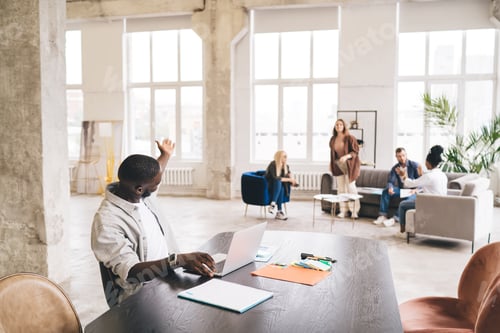Preview: Group of diverse people working in spacious office