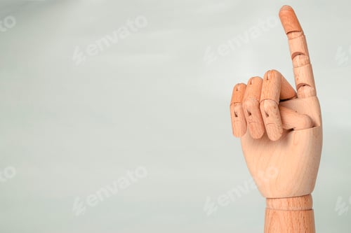 Preview: A wooden orthopedic hand on white background.