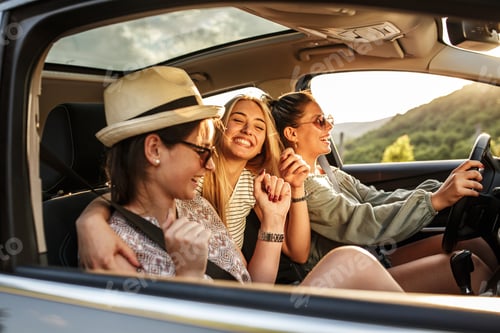 Three Smiling Women Enjoying Road Trip Together