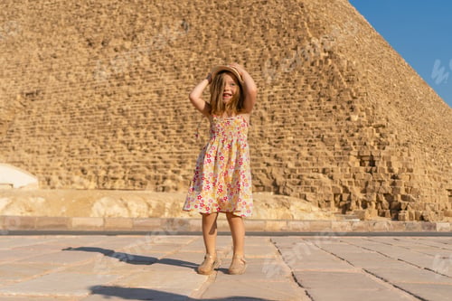 Preview: Cute little girl dancing in front of the Cheops pyramid on the Giza plateau