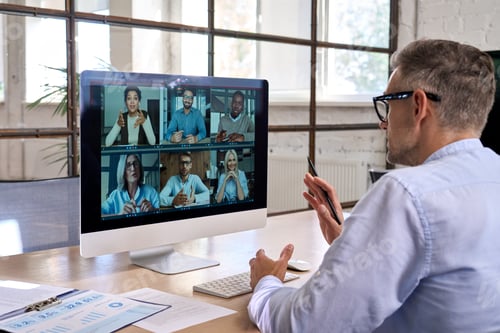 Vista previa: Corporate manager leading videoconference with team business people on computer.