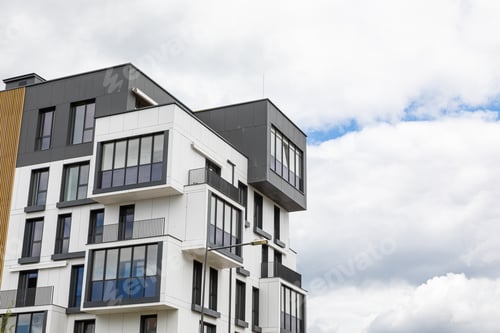 Preview: Outside view on upper floors of modern house building with balconies