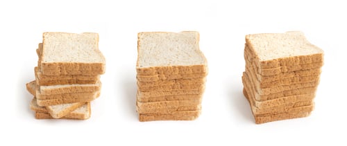 Preview: Stacks of Sliced Bread on a White Background
