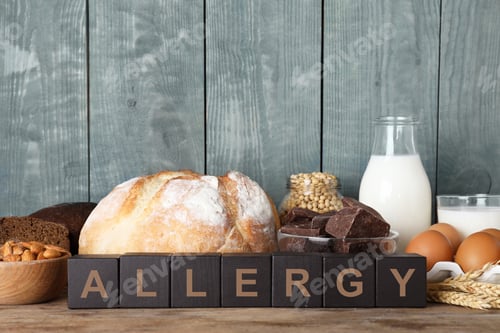 Preview: Different products on wooden background. Food allergy concept