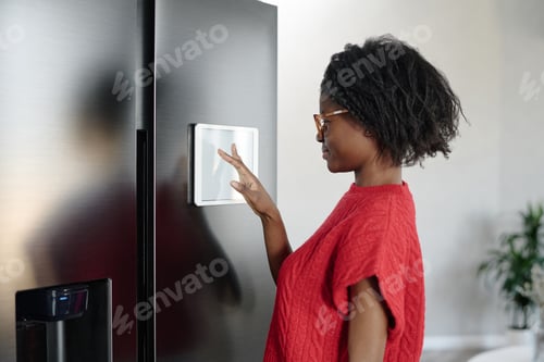 Preview: African American Housewife Enjoying Smart Fridge App