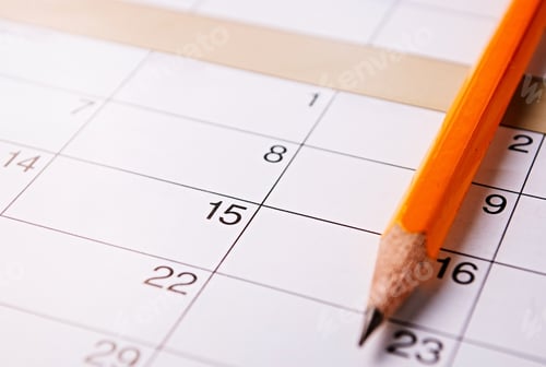 Preview: Pencil lying on a calendar