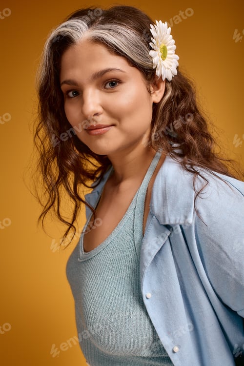 Preview: Unique beauty shines through style in studio setting with vibrant background