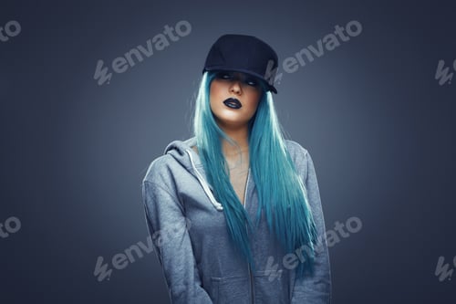 Preview: Young woman with cyan color hair in hoodie and cap