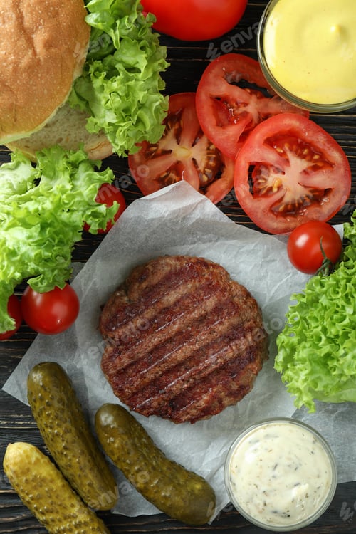 Preview: Concept of cooking burger on wooden table