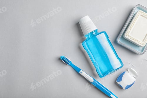 Preview: Flat lay composition with oral care products and space for text on light background. Teeth hygiene