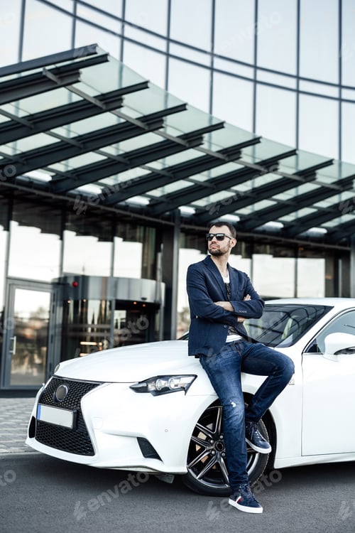 Preview: A skyscraper on the background and confident guy with his car