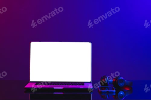 Preview: Composite of laptop with blank screen and video game accessories, copy space on neon background