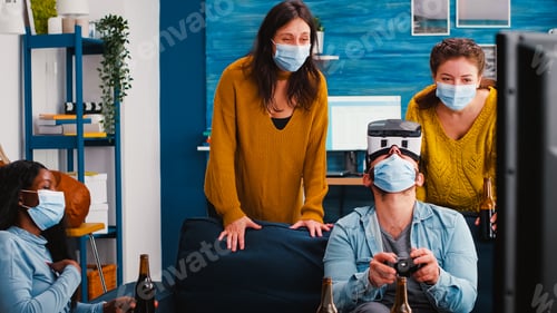 Preview: Friends having fun playing video game experiencing virtual reality