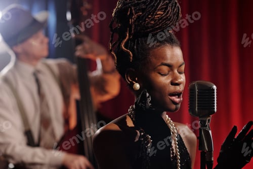 Preview: Black Woman Singing Jazz into Microphone during Live Performance