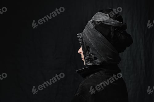 Preview: Portrait of a woman in jeans jacket and denim headdress. Black jeans clothing, total denim.