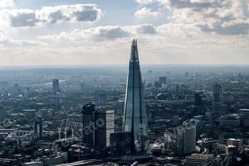 Preview: Aerial view of a city skyline with a towering skyscraper dominating the landscape