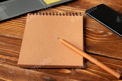 Preview: Open laptop with blank notebook, view from above. Workplace concept