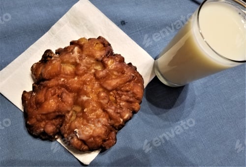 Apple Fritter and Glass of White Liquid