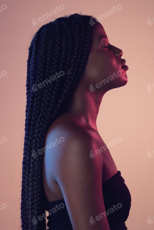 Preview: Calm, beauty and black woman with braids in studio with makeup, cosmetic and face routine. Sensual,