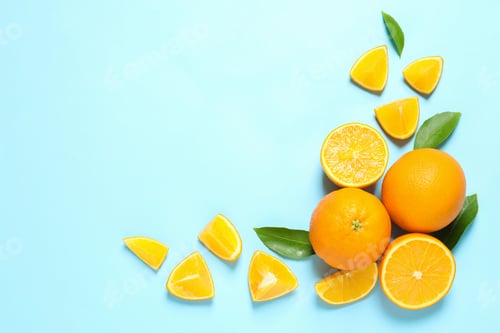 Preview: Flat lay composition with ripe oranges and space for text on color background