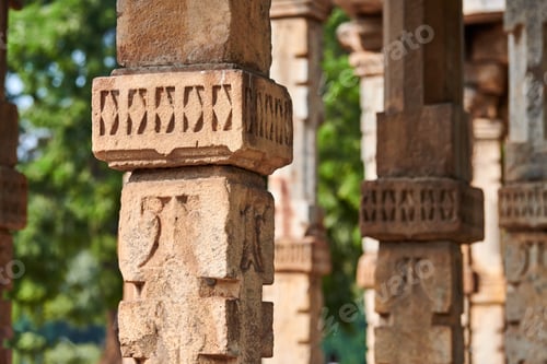 Preview: Stone columns with decorative bas relief of Qutb complex in South Delhi, India, close up pillars