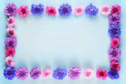 Preview: Flower frame of cornflowers on blue background
