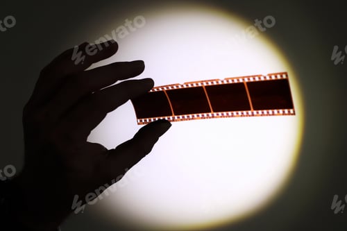 Preview: Photographic film negatives held up to the light