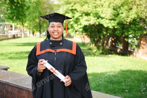 Preview: pretty african female college graduate at graduation