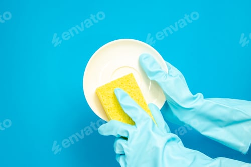 Preview: Dishwashing concept, Hands in rubber gloves to holding yellow sponge and wash the dishes