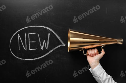 Preview: Woman holding retro megaphone and word NEW on chalkboard