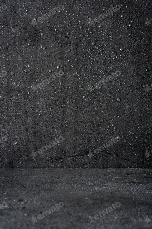 Preview: Water droplets forming on dark gray concrete wall and floor