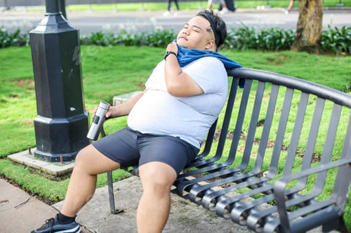 Preview: Fat Man Enjoying Sitting on Bench After Workout