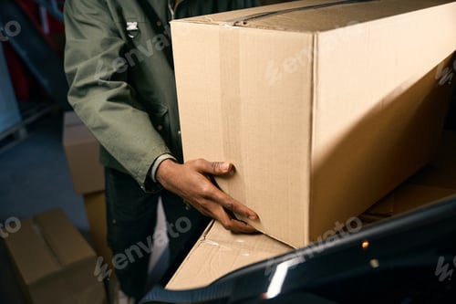 Preview: Man takes things out of a car in a storage service