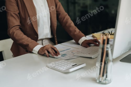 Preview: Close up business woman or accountant working computer at office.