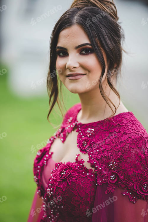 Preview: Vertical shot of a white Caucasian woman posing on a blurred background