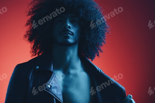 Preview: Portrait of fashion man with curly hair on red background multinational, colored light, black