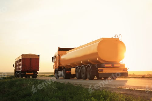 Preview: Modern bright trucks parked on country road