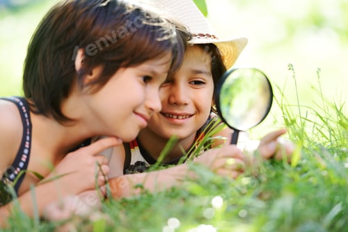Preview: Two Boys With Magnifying Glass Outdoors