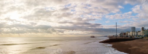 Preview: Calm sea next to a coastal town panoramic view
