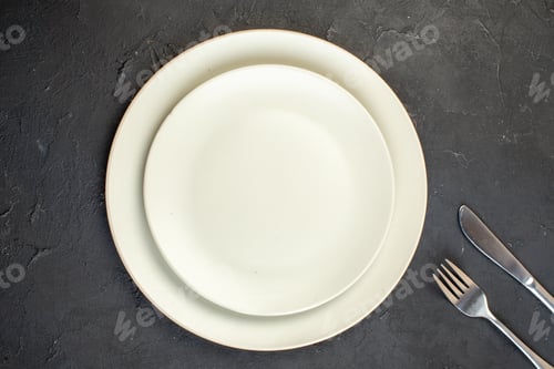 Preview: top view white plates with knife and fork on dark background restaurant kitchen color horizontal