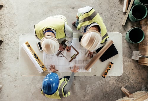 Preview: Architect, engineer and teamwork with blueprint from above on a building or contractor project. Bui