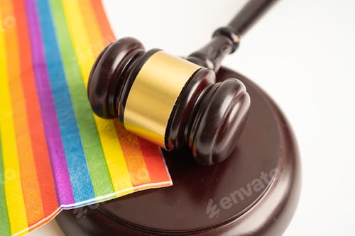 Preview: Gavel for judge lawyer on rainbow flag, symbol of LGBT pride month celebrate annual