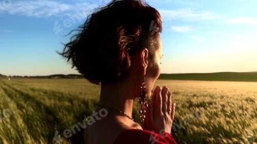 Preview: Believing woman with her eyes closed asking for forgiveness and peace. Stock clip. Feeling unity
