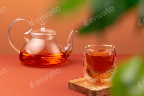 Preview: Glass teapot and cup with black tea