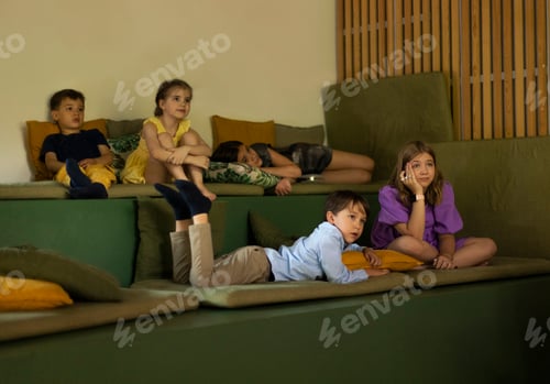 Preview: Little boys and girls look shocked and surprised watching movie in home cinema