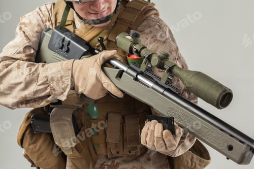 Preview: Soldier prepares a sniper rifle in a tactical setting for precision shooting practice