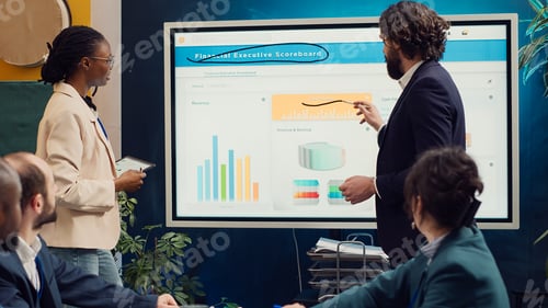 Preview: Tensed business team studying statistics to find issues within project structure